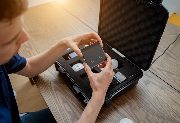 A technician works with a demo kit of the smart home system