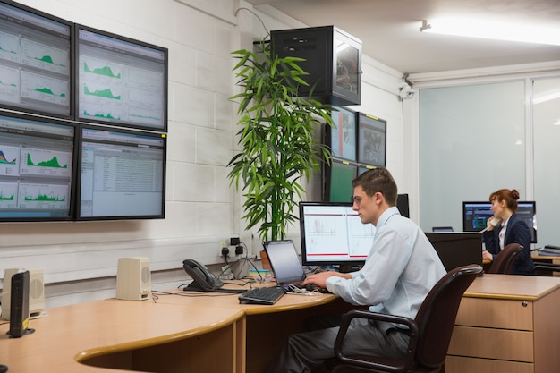 Technicians sitting in office running diagnostics