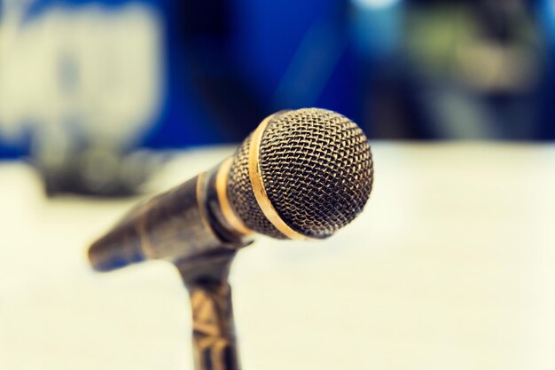 Photo technology, electronics and audio equipment concept - close up of microphone at recording studio or radio station