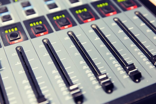 Photo technology, electronics and equipment concept - control panel at recording studio or radio station