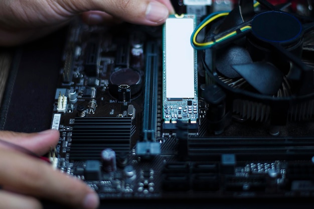 Technology to speed up computer Experts are installing speed devices on motherboard Closeup