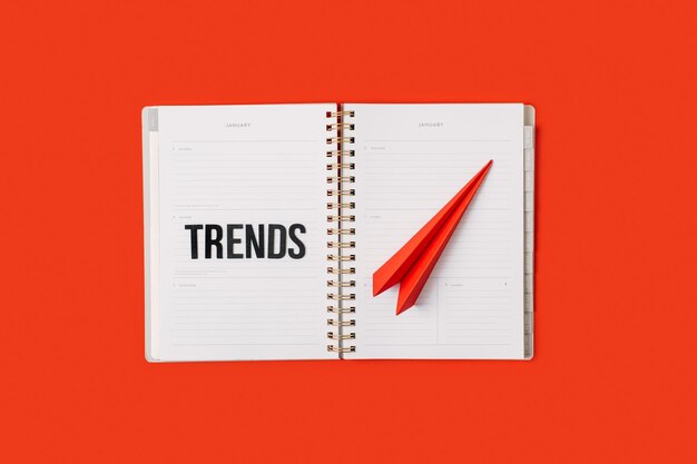 Photo technology trends tech trends top new technology word trends on open notepad with different gadgets