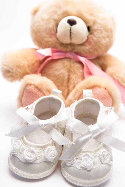 Teddy bear for a girl with white baby booties