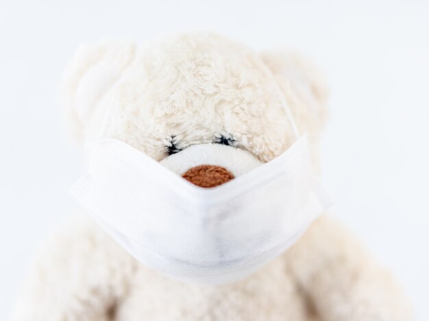 Teddy bear wearing medical mask