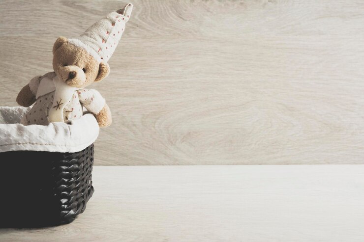 Teddy bear in a wicker basket