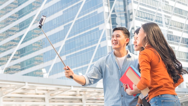 teen asia people use smart phone to selfie