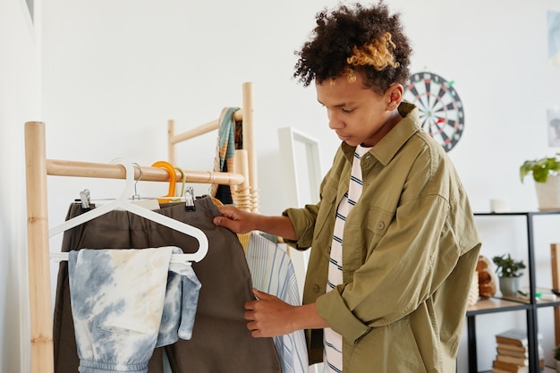 Teen Boy Choosing Clothes