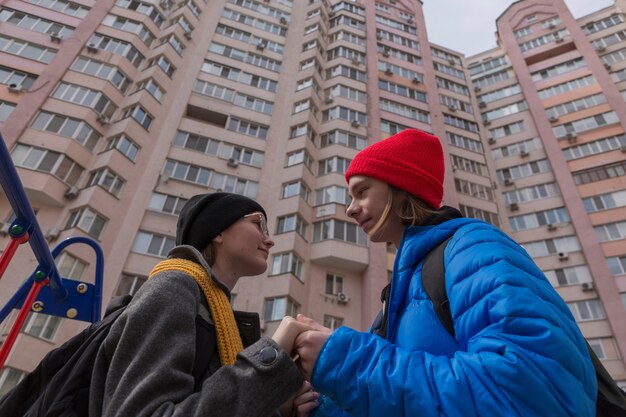 Teen boy and teen girl on a walk in bright clothes Relationship concept during puberty