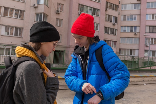 Teen boy and teen girl on a walk in bright clothes Relationship concept during puberty