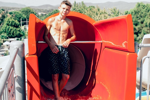 Teen boy at water slides