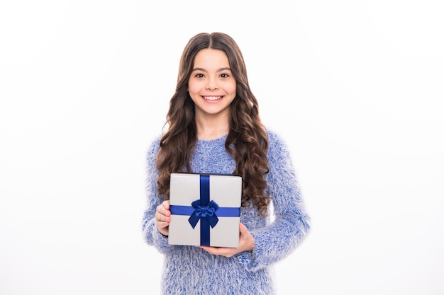 Teen celebrating birthday Teenager girl wear winter sweater celebrating christmas holidays on white studio background Merry Christmas presents Happy New Year celebration