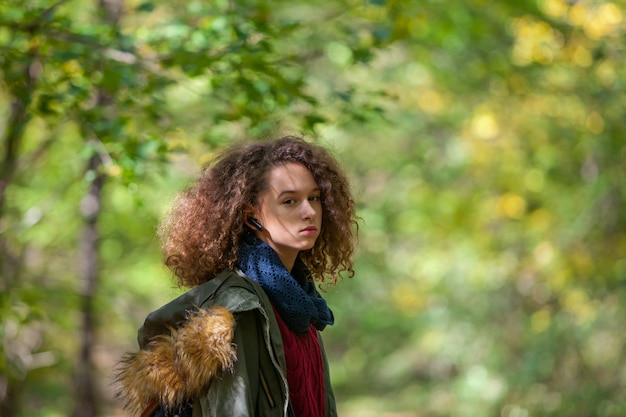 Teen girl in autumn park