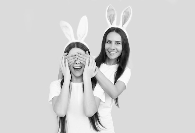 Teen girl child and mom having fun kid and woman looking funny paschal spring holiday friendship mother and daughter wear bunny ears happy easter rabbit family bunny hunt