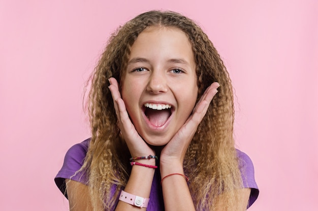 Photo teen girl on a pink background