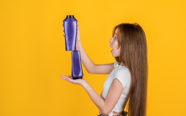 Teen girl wash long straight hair with shampoo and condirioner beauty salon