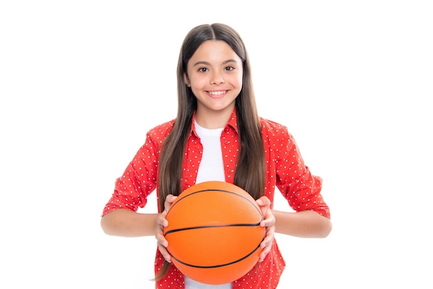 Teen girl with basketball ball isolated on white background Portrait of happy smiling teenage child girl