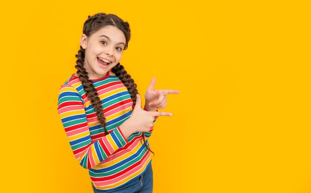 teen girl with braids on hair in studio with copy space photo of teen girl having braids
