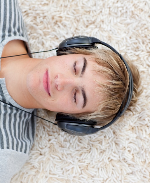 Teen guy listening to music