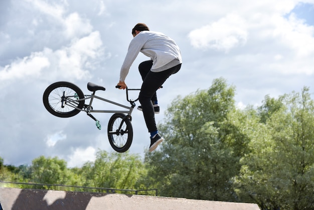 Teen rides an extreme stunt bike