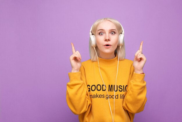 Teen woman enjoys music isolated