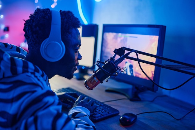 Teenage boy arranging stream during online video games