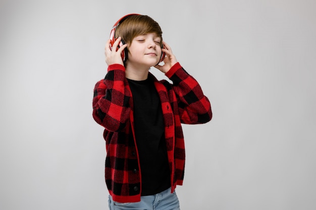 Teenage boy in fashionable clother and headphones