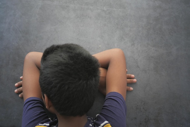 Teenage boy head down on desk