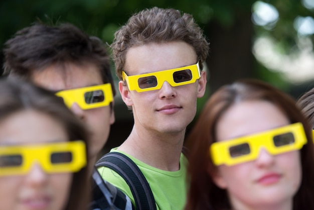 Teenage boy and his friends with 3d glasses