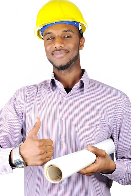 Teenage construction worker with plans and thumbs up