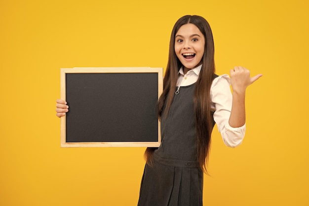 Teenage girl child hold chalkboard elementary school girl\
holding blank blackboard chalk board copy