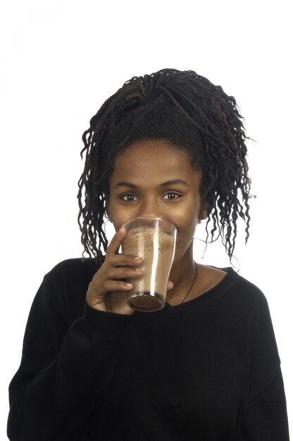 Teenage girl drinking milk and chocolate