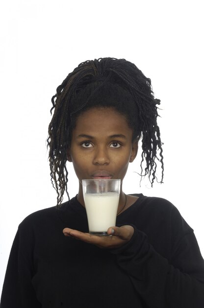 Teenage girl drinking milk