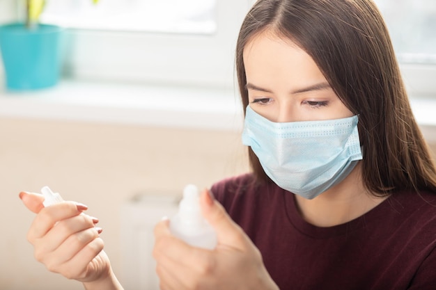 Teenage girl examines prescription drugs in the medical office at the doctor's appointment in the hospital