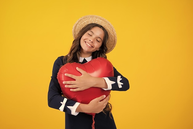 Teenage girl hold shape heart balloon heartshape sign child holding a red heart love holiday valentine symbol