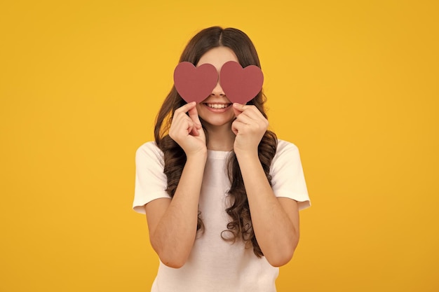 Teenage girl hold shape heart heartshape sign child holding a red heart love holiday valentine