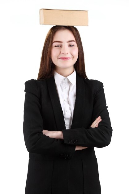 Teenage girl holding book on white background