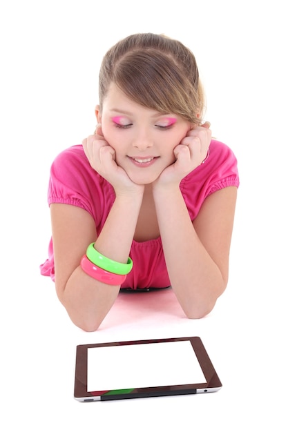 Teenage girl lying and using tablet pc over white