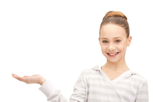 teenage girl showing something on the palm of her hand