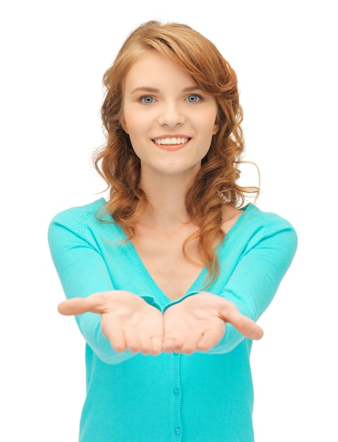 teenage girl showing something on the palms of her hands