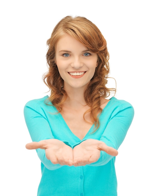 teenage girl showing something on the palms of her hands