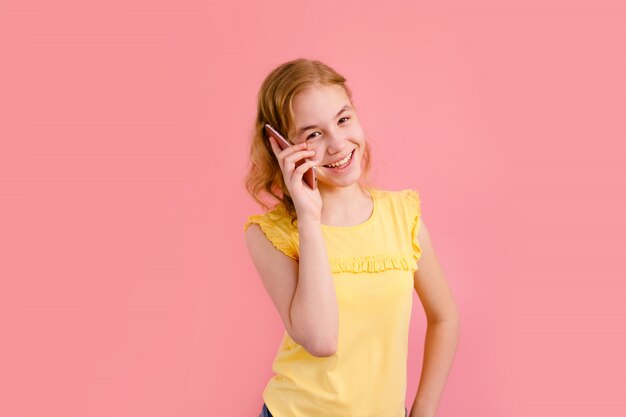 A teenage girl speaking on a phone