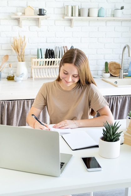 teenage girl studying from home