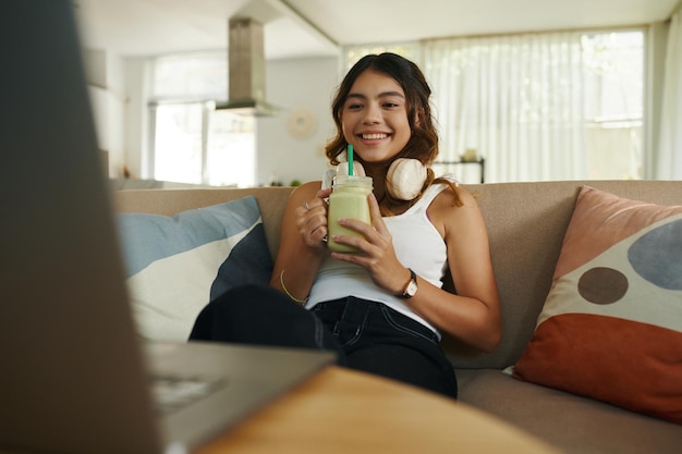 Teenage Girl Watching Show on Laptop