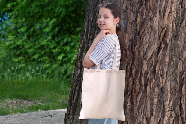 Teenage girl with canvas bag on her shoulder