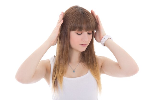 Teenage girl with headache isolated on white background