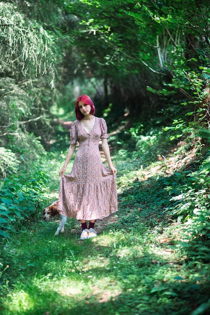 Teenage girl with red hair in summer dress