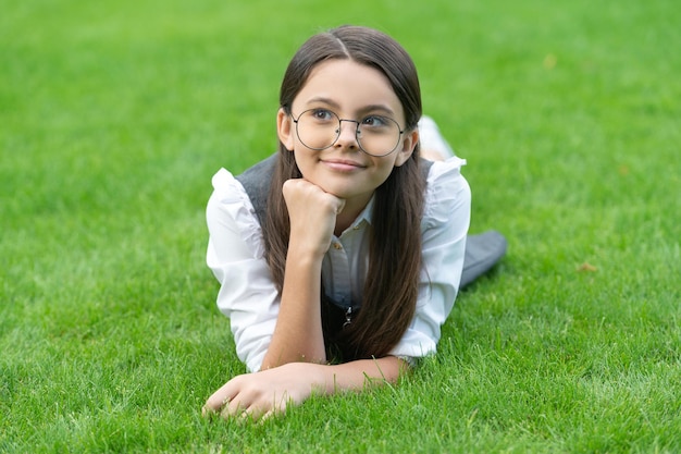 Teenage girl with thoughtful face Portrait of pensive teenage girl in glasses after school teenage