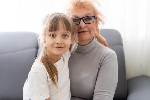 Teenage Granddaughter Visiting Grandmother At Home.