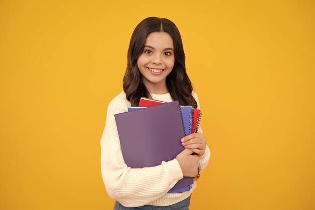 Teenage school girl with books schoolgirl student happy face positive and smiling emotions of teenager girl