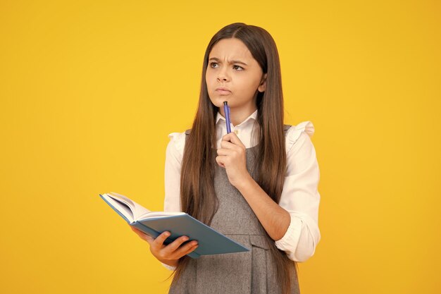 Teenage school girl with books schoolgirl student thinking teenager girl thoughtful emotion